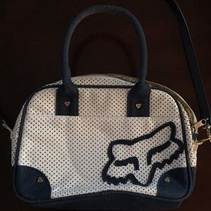 White and navy blue Fox racing bag